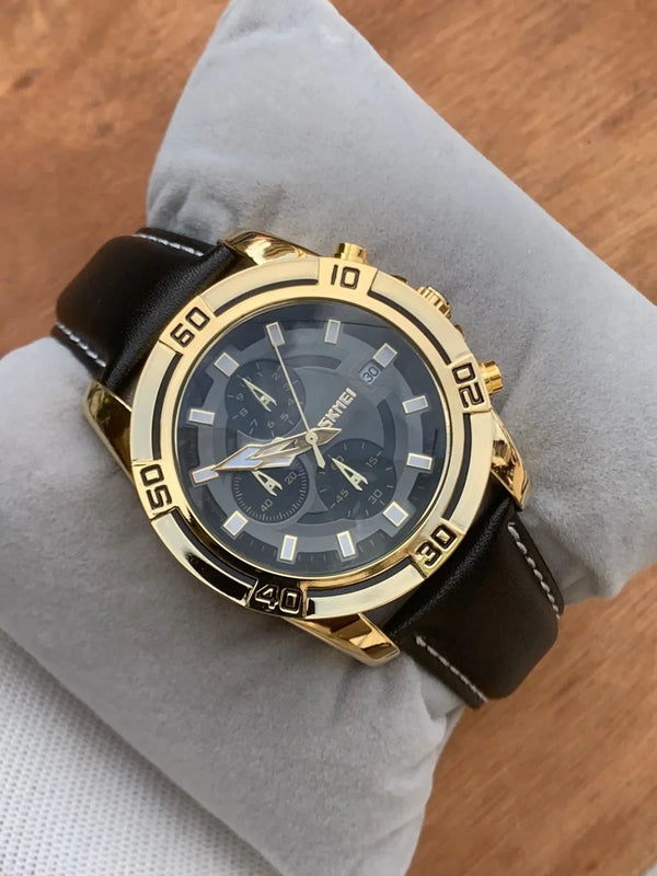 Men's gold-tone chronograph wristwatch with black leather strap on cushion display
